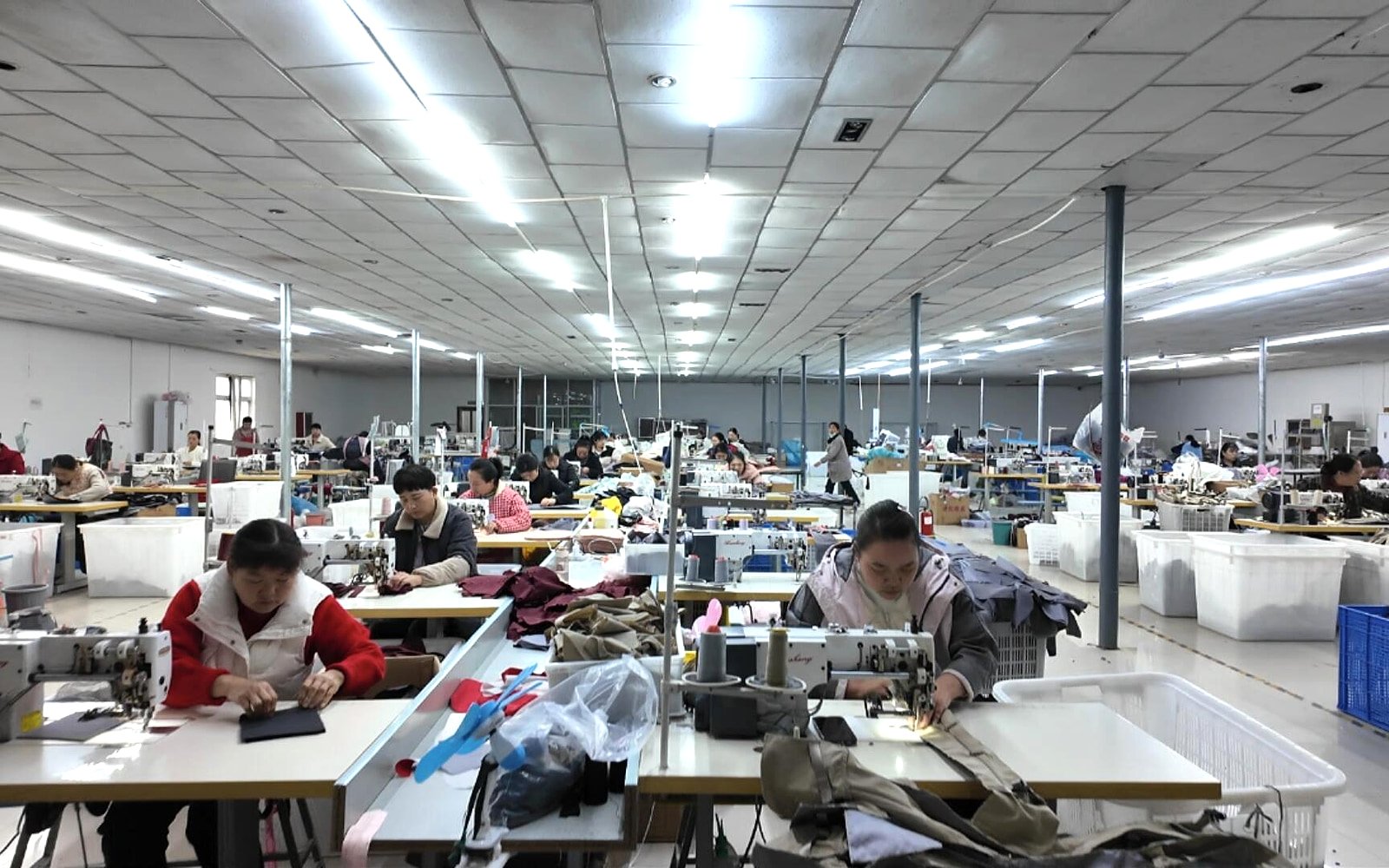 Workers sewing bags in the Pengnan Bags production workshop