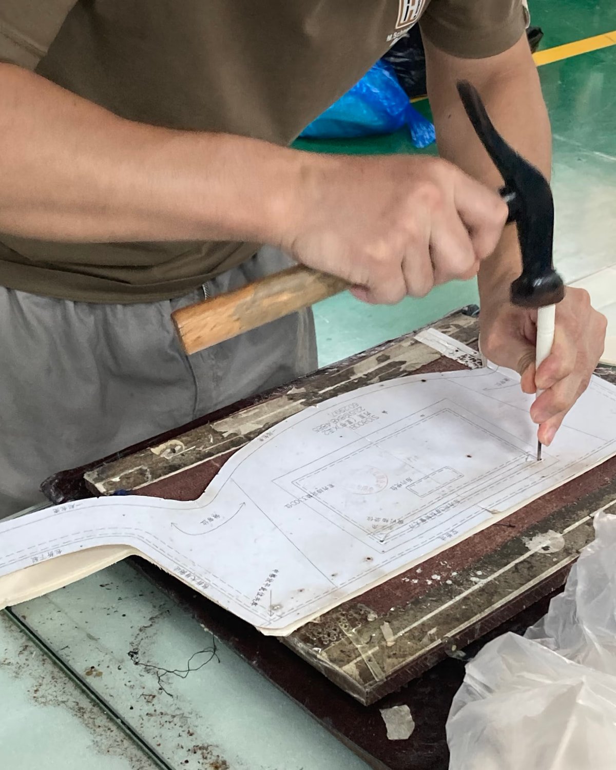 Worker preparing a bag pattern for production